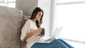 Woman Viewing Information About Massage Therapy Certification in NC